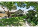 This home has nice landscaping, a covered porch, and a well-maintained lawn at 9065 Sw 82Nd Ter # G, Ocala, FL 34481