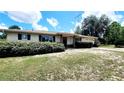 Inviting single-Gathering home with a well-maintained lawn and mature shrubbery framing the facade at 16905 Sw 30Th Avenue Rd, Ocala, FL 34473