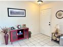 Entryway featuring neutral walls, tile flooring, and decorative furnishings at 10130 Sw 61St Terrace Rd, Ocala, FL 34476