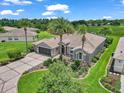 Expansive aerial view of property with lush landscaping, a well-manicured lawn, and a paved driveway at 1443 Sw 161St St, Ocala, FL 34473