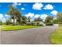 Spacious lot with a home featuring mature trees and plenty of parking space at 1922 Se 13Th St, Ocala, FL 34471