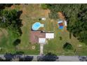 Bird's eye view showcases the sparkling blue pool and the property's generous outdoor space at 2340 Ne 14Th Ave, Ocala, FL 34470