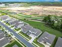 Stunning aerial shot showcases the neighborhood, highlighting the home's proximity to green spaces and amenities at 7067 Sw 60Th Ln, Ocala, FL 34474