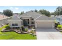 Charming one-story home with landscaped front yard and neutral stucco at 7243 Se 172Nd Legacy Ln, The Villages, FL 32162