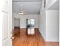 Inviting living room with high ceilings, lots of natural light, and gleaming hardwood floors at 10819 Sw 84Th Ter, Ocala, FL 34481