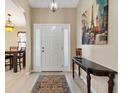 Inviting foyer with a decorative rug and table, setting a warm tone at 12178 Se 174Th Pl, Summerfield, FL 34491