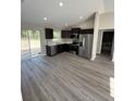 Modern kitchen with stainless steel appliances and sleek countertops, and views to the outside at 2350 Sw 150Th Ct, Ocala, FL 34481