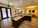Open kitchen featuring granite countertops, a breakfast bar, and stainless steel appliances at 3803 Se 6Th Ave, Ocala, FL 34480