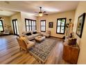 Bright living room with hardwood floors, plantation shutters, and neutral tones at 3803 Se 6Th Ave, Ocala, FL 34480