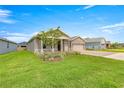 Charming single-story home featuring a well-manicured lawn and a two-car garage at 4474 Nw 53Rd Ave Rd, Ocala, FL 34480
