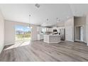 Bright, open kitchen with stainless steel appliances, large island, and lots of natural light at 82 Bay Rd, Ocklawaha, FL 32179