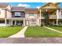 Charming townhouses featuring unique facades, manicured lawns, and inviting entrances at 8830 Sw 98Th Pl # M, Ocala, FL 34481