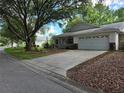 Charming single Gathering home with a two-car garage, front porch, and well-maintained landscaping at 8959 Sw 96Th Ln # A, Ocala, FL 34481