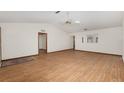Large open living room with wood-look floors, neutral paint, and a ceiling fan at 8959 Sw 96Th Ln # A, Ocala, FL 34481