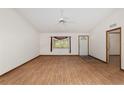 Living room features wood-look floors, ample natural light, and neutral walls at 8959 Sw 96Th Ln # A, Ocala, FL 34481