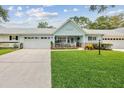 Charming house with an attached garage, manicured lawn, and inviting curb appeal at 8961 Sw 96Th Ln # C, Ocala, FL 34481