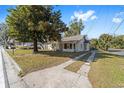 Lovely home with mature trees, a spacious front yard and a traditional driveway at 114 Ne 11Th Ave, Ocala, FL 34470