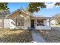 Charming bungalow with a welcoming front porch, curb appeal, and sunny day view at 114 Ne 11Th Ave, Ocala, FL 34470