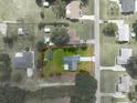 Aerial view of a home showcasing its spacious lot, complemented by a well-defined property line at 205 Ne 53Rd St, Ocala, FL 34479