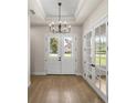 Foyer features hardwood floors and double doors leading outside at 2792 Se 29Th St, Ocala, FL 34471