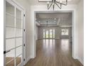 Bright, open-concept living space with wood floors and recessed lighting at 2792 Se 29Th St, Ocala, FL 34471