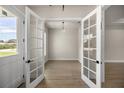 Office with French doors and neutral walls for a tranquil workspace at 2792 Se 29Th St, Ocala, FL 34471