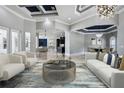Bright living room with custom ceiling, stylish furniture, and an open floor plan at 3440 Sw 66Th St, Ocala, FL 34476