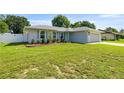 Single-story home with a well-manicured lawn and tidy landscaping at 4325 Se 60Th St, Ocala, FL 34480