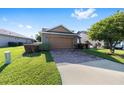 Charming single-story home with a brick-paved driveway and well-maintained lawn at 4970 Nw 35Th Lane Rd, Ocala, FL 34482