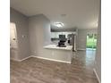 Modern kitchen with white cabinets, stainless steel appliances, and a breakfast bar at 5 Laurel Pass Ln, Ocala, FL 34472