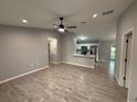 Open-concept living space with tile flooring, neutral paint, and a ceiling fan at 5 Laurel Pass Ln, Ocala, FL 34472