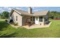 Inviting patio with a charming swing, perfect for relaxing outdoors at 7443 Sw 102Nd Pl, Ocala, FL 34476