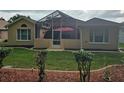 Enclosed backyard patio and a well maintained lawn at 11298 Sw 73Rd Cir, Ocala, FL 34476