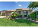 Charming home with a well-maintained lawn and tiered landscaping in the front yard at 3001 Hillside Ln, The Villages, FL 32162