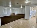 Spacious living room featuring a seamless flow with neutral walls and flooring to add your own personal touches at 3801 Sw 147Th Lane Rd, Ocala, FL 34473