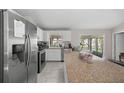 Bright kitchen features stainless steel appliances, a large island, and white cabinets at 42 Almond Dr, Ocala, FL 34472