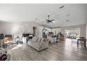 Spacious living area seamlessly integrates a modern kitchen and dining space at 42 Almond Dr, Ocala, FL 34472