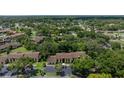 Aerial view of the condo community surrounded by mature trees and lush landscaping at 505 Fairways Ln # B, Ocala, FL 34472