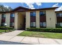 The condo building boasts neat landscaping and a neutral color scheme at 505 Fairways Ln # B, Ocala, FL 34472