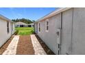 View of back yard and neighboring home with verdant lawn at 5233 Nw 43Rd Lane Rd, Ocala, FL 34482