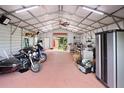 Spacious garage with high ceilings, offering plenty of room for storage and hobbies at 581 Ne 44Th Ave, Ocala, FL 34470