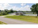 Charming single-story home featuring a two-car garage, well-maintained lawn, and surrounded by a secure white fence at 6250 Se 88Th St, Ocala, FL 34472
