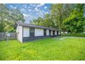 Well-kept front yard with lush green grass complements this quaint single story home at 6021 Nw 54Th Ter, Ocala, FL 34482
