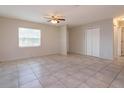 Open living room with tile flooring, neutral walls, and a ceiling fan at 956 Osceola Trl, Casselberry, FL 32707