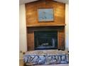 The fireplace is constructed from stone and has wood finish above at 4450 Old Berkley Rd, Auburndale, FL 33823