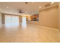 Expansive living room with tile flooring, ceiling fan, and sliding glass doors leading to the outdoors at 4577 Back Nine Dr, Winter Haven, FL 33884