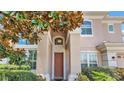 Two-story home's entrance with a large front door at 318 Crescent Ridge Rd, Auburndale, FL 33823