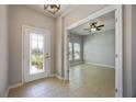 Bright entryway with tile flooring and access to an office at 1912 Castleton Dr, Saint Cloud, FL 34771