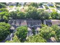 Aerial view of townhouses nestled amongst mature trees at 2310 Isle Royale Se Ct, Winter Haven, FL 33880