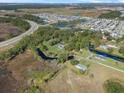 Aerial view showing home, large lot, and nearby community at 222 Rod Ln, Davenport, FL 33837